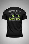 Rear view of black athletic-fit 405 Defense Apparel t-shirt featuring “Own The Dark” graphic with green night vision goggles and bold DARK text on gray background.
